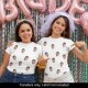 2 girls showing grooms face on t-shirts on hen do