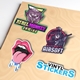 A set of colourful vinyl die-cut stickers on a beige surface. Designs include a 