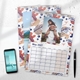 Personalised A4 photo calendars with colourful patterned borders displayed beside a phone and pen