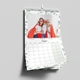 A 2025 A4 photo calendar opened to February, featuring your own photo or picture. The calendar is spiral-bound with a white hanging hook, showcasing a clean grid layout for daily notes and reminders.