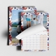 An A3 photo calendar featuring your own photo or picture on the top page. The calendar is spiral-bound and partially open, revealing a blank month grid. Behind it, another personlaised image of your choice