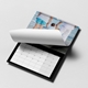 Open personalised A3 photo calendar with a beach family photograph, monthly grid and page being turned.