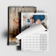 Two personalised A4 family photo calendars with a marble border and a curled page revealing the monthly grid.