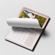 Personalised pink A3 photo calendar showing a page being turned over the monthly date grid.