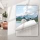 An A4 photo calendar on a wall opened to June. The photo Can be any image of your choice. The calendar is spiral-bound with a blank monthly grid for June. A modern living room is visible in the background.