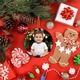 Festive flat lay featuring a personalised ceramic bauble with a photo of a young child in a white shirt. Surrounding the bauble are Christmas decorations, including pinecones, a gingerbread man, peppermint sweets, and red gift boxes.