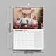 A 2025 A3 photo calendar open to December, featuring a family of four wearing matching outfits and Christmas hats, seated by a decorated tree. A 