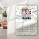 Personalised A3 photo calendar hanging on a wall with leafy design and children’s photograph
