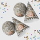 Customised party hatswith your own image and number, arranged alongside scattered colourful confetti. The hats are displayed in upright and side positions, ideal for festive celebrations.