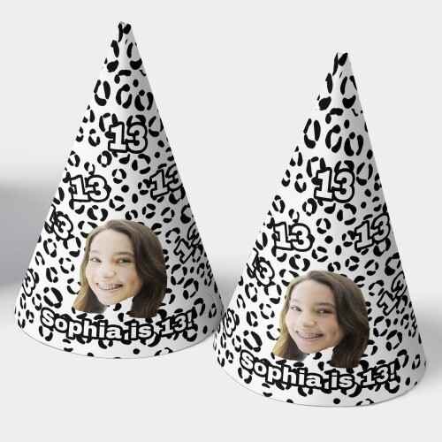 Two customised party hats with a white background, personalised with your photo and number of your choice. The hats are displayed upright side by side. Perfect for birthdays or celebrations.