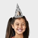 Smiling girl wearing a customised party hat with your own face and number. The girl has pigtails and is laughing, showcasing the fun design. Ideal for birthdays or themed celebrations.