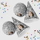 Customised party hatswith your own image and number, arranged alongside scattered colourful confetti. The hats are displayed in upright and side positions, ideal for festive celebrations.