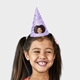 Smiling girl wearing a customised party hat with your own face and number. The girl has pigtails and is laughing, showcasing the fun design. Ideal for birthdays or themed celebrations.