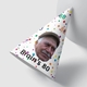 Personalised party hat with a colourful polka dot design, featuring the text Brain's 80 and a photo of an elderly man wearing a flat cap. The hat is cone-shaped and placed against a white background.