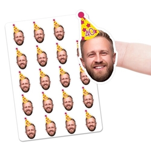 Sheet of personalised vinyl stickers featuring a smiling man's face wearing a colourful party hat with the number 40. One sticker is being peeled off by hand to show size and cut. Ideal for birthdays, hen and stag dos, and custom celebrations.