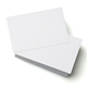 A stack of blank white business cards with one card placed on top at an angle, highlighting its smooth, clean surface against a white background.