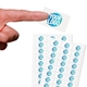 Transparent custom rectangle label sticker with a blue and white logo, shown on a fingertip, alongside two sheets filled with multiple identical stickers. Ideal for personalised branding or product labelling.