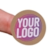 Kraft circle label sticker with a custom purple and white logo, shown on a fingertip. The natural brown background of the label gives a rustic and eco-friendly appearance, ideal for personalised packaging.