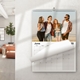 A 2025 A4 photo calendar displayed on a wall, opened to June. The photo features four friends walking on a beach, smiling and wearing casual summer outfits. The calendar is spiral-bound with a blank monthly grid for June. A modern living room is visible in the background.