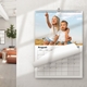 Personalised A4 wall calendar displayed in a home with a photograph and monthly date grid