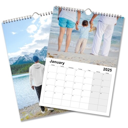 A 2025 A3 photo calendar showing January. One image features a family holding hands on a beach, and the other shows a person standing by a lake with mountains in the background. The calendar is spiral-bound with space for personalised images above each month.